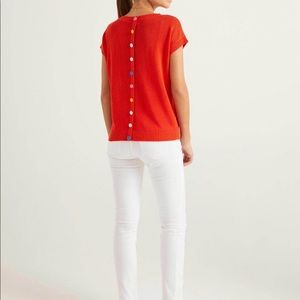 Boden short-sleeve sweater with multi-color covered buttons on reverse.